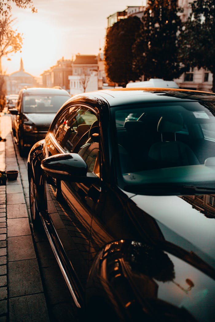 hero-img-02 A sleek black car parked on an Istanbul street, captured at sunset with a warm, urban ambiance.